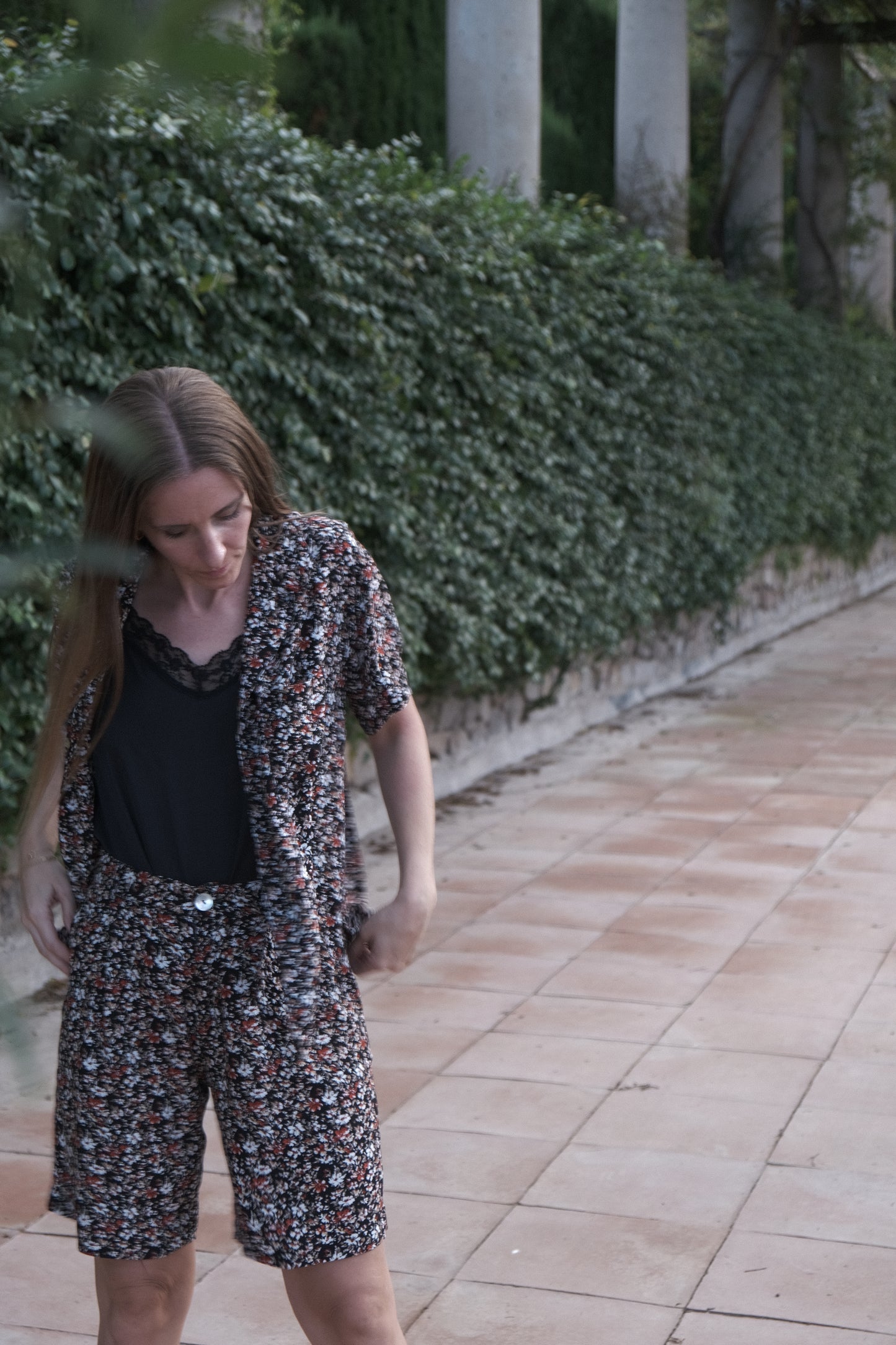 Girl in a mambo flower suit bermuda and shirt