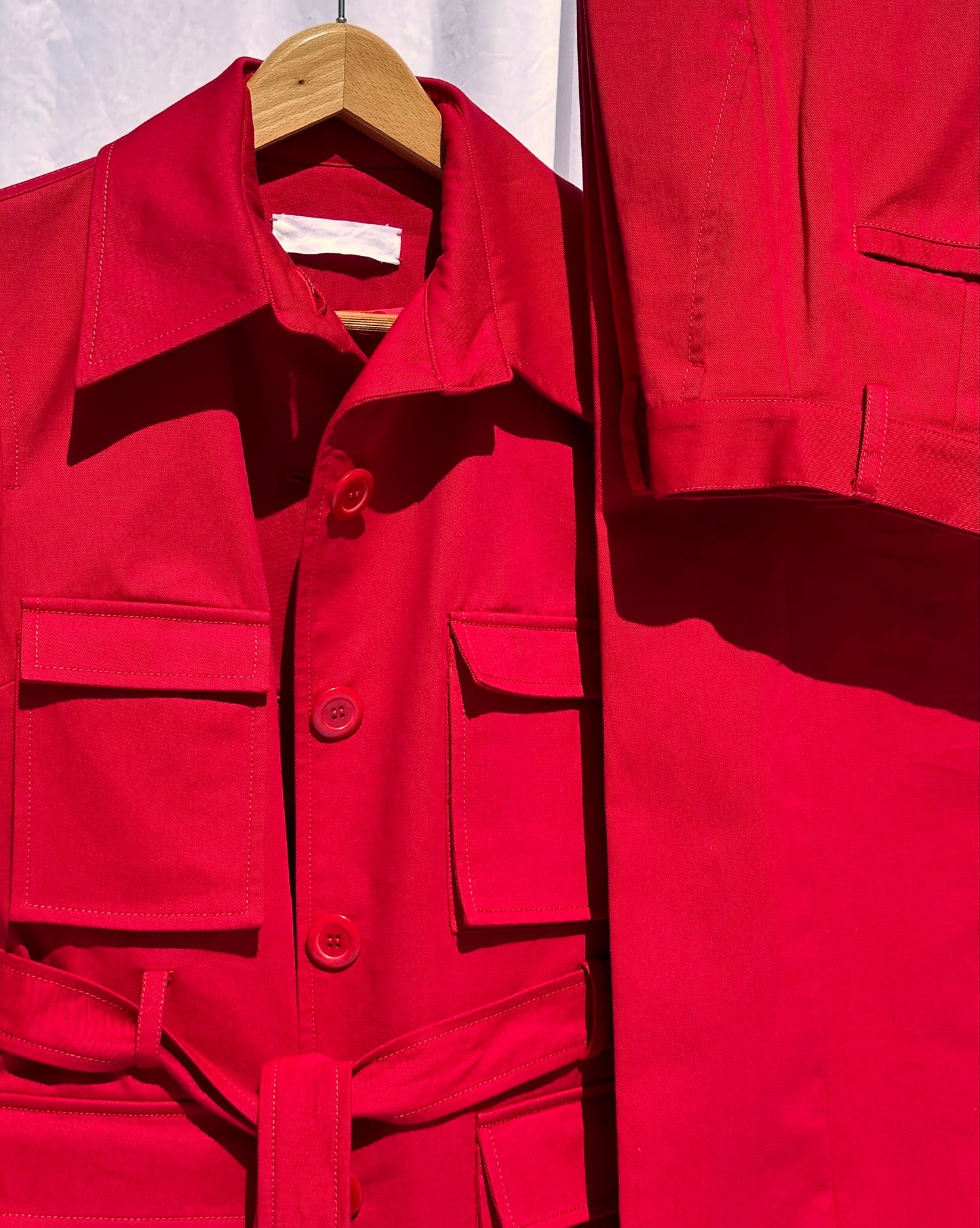 Front detail of the Red Safari Jacket and  also a detail of the red safari trouser